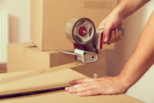 Person packing moving boxes